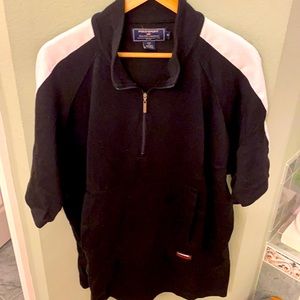 Short sleeve jersey.  Moderate weight.  Zipper front with snap pockets.